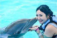 Woman Kissing Dolphin